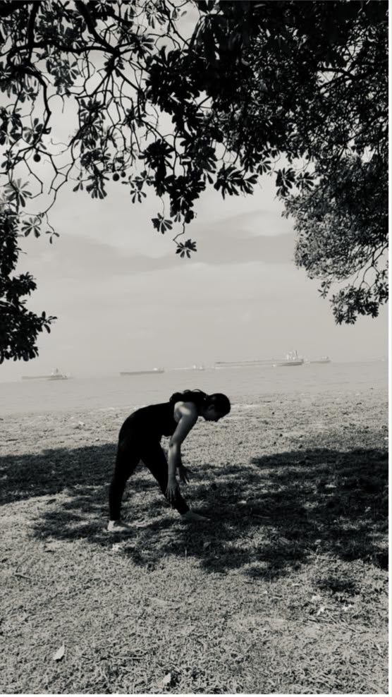 Karuna practicing yoga, seaside