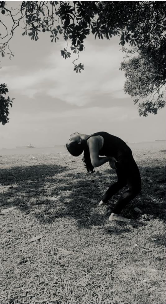 Karuna practicing yoga, seaside