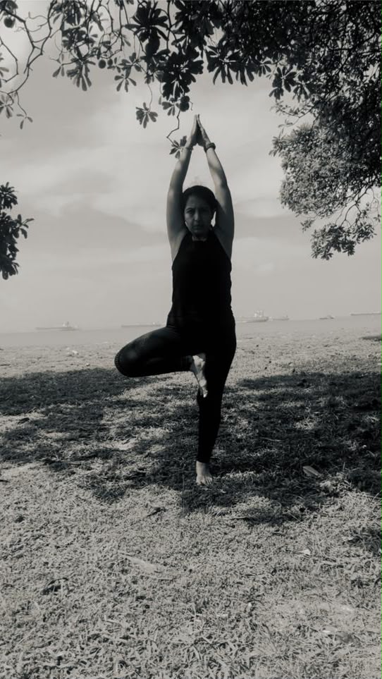 Karuna practicing yoga, seaside