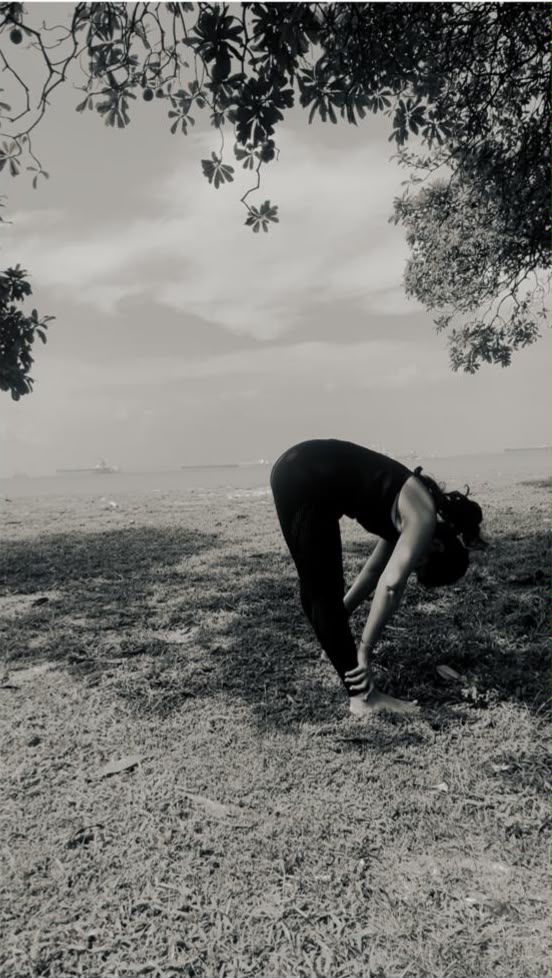 Karuna practicing yoga, seaside