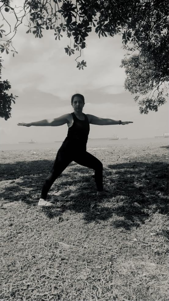 Karuna practicing yoga, seaside